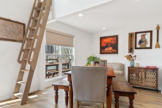 dining area featuring baseboards, light wood-type flooring, and recessed lighting