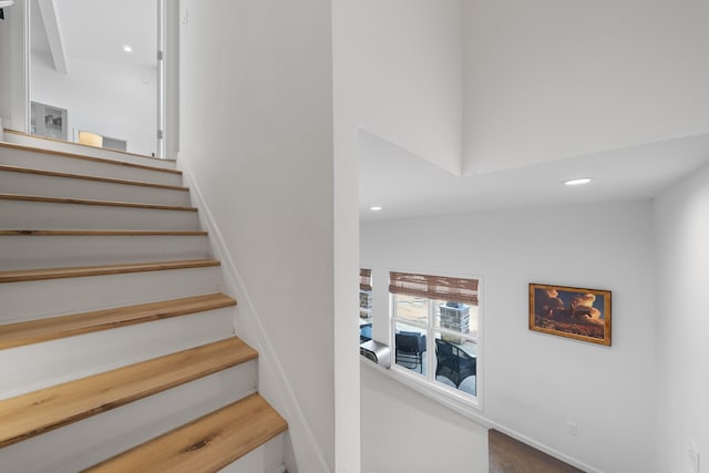 stairs featuring recessed lighting