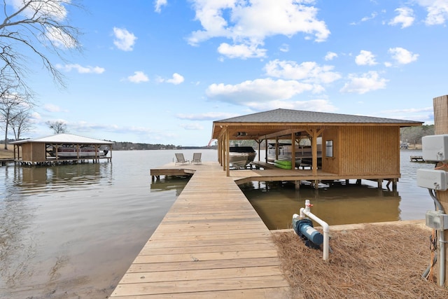 dock area featuring a water view and boat lift