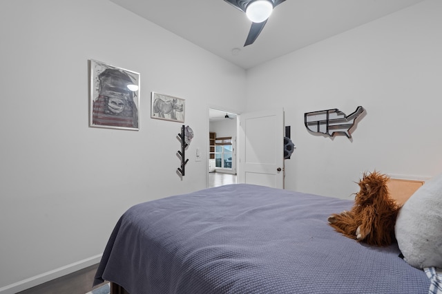 bedroom with ceiling fan and baseboards