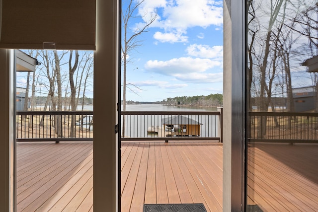 wooden deck with a water view