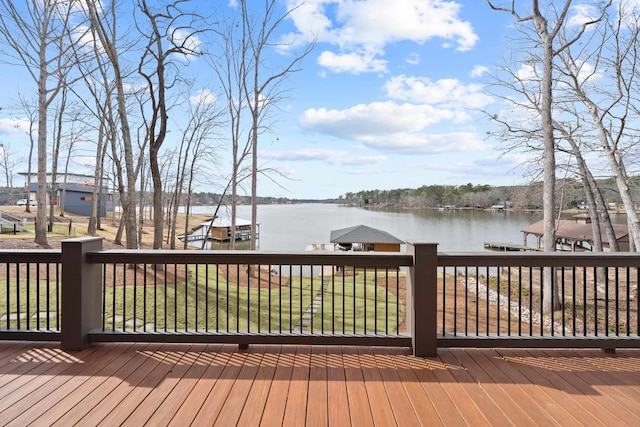 deck featuring a yard and a water view