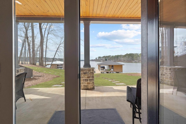 entryway with a water view and wood ceiling