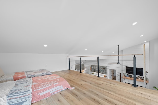 bedroom with lofted ceiling, light wood-style floors, and recessed lighting