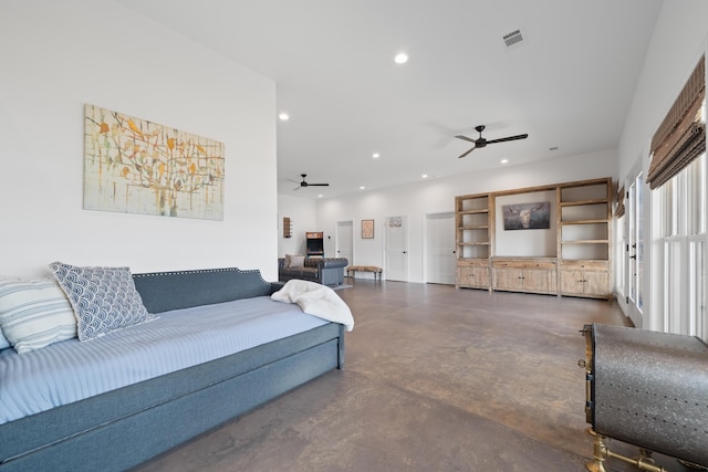 living area featuring ceiling fan, concrete floors, visible vents, and recessed lighting