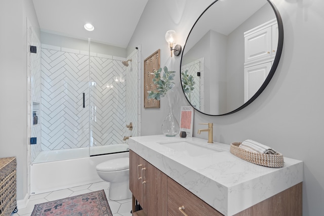 full bathroom featuring vanity, combined bath / shower with glass door, toilet, and tile patterned floors