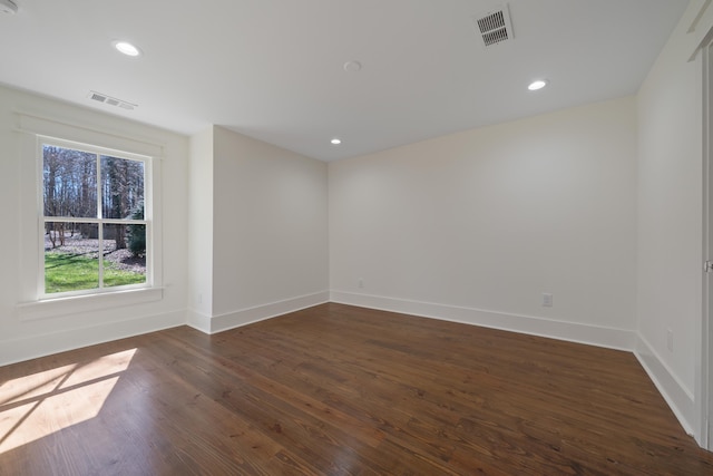 136 Hidden Lake Dr, Eatonton, GA 31024 - spare room featuring dark wood-type flooring, recessed lighting, visible vents, and baseboards