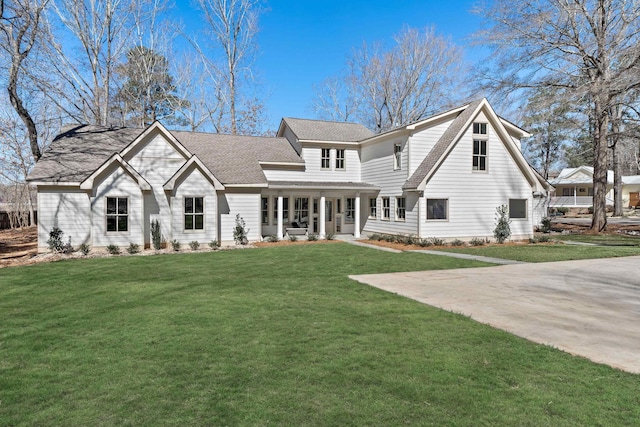 136 Hidden Lake Dr, Eatonton, GA 31024 - view of front of property featuring a porch, roof with shingles, and a front lawn