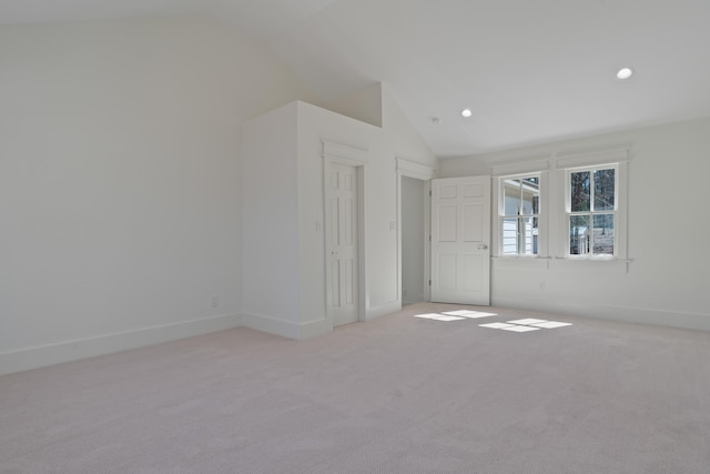 136 Hidden Lake Dr, Eatonton, GA 31024 - unfurnished bedroom featuring recessed lighting, light colored carpet, vaulted ceiling, and baseboards