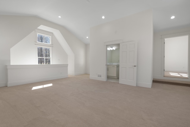136 Hidden Lake Dr, Eatonton, GA 31024 - additional living space with vaulted ceiling, recessed lighting, baseboards, and light colored carpet