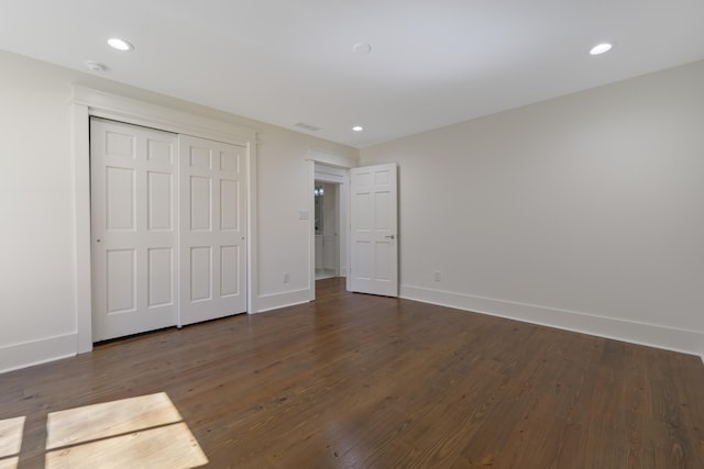 136 Hidden Lake Dr, Eatonton, GA 31024 - unfurnished bedroom with recessed lighting, dark wood finished floors, and baseboards