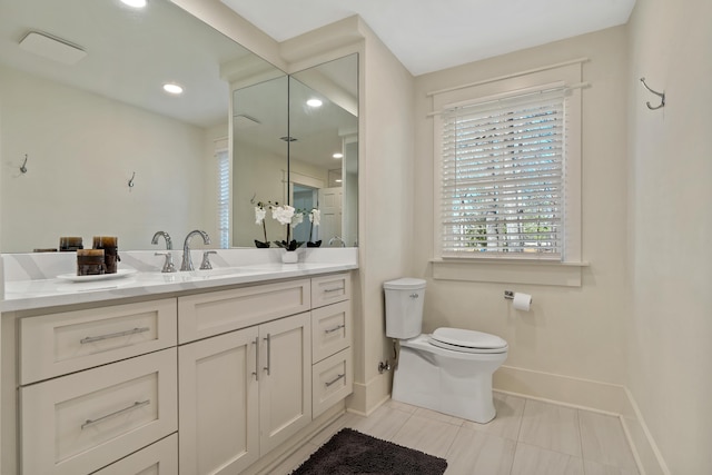136 Hidden Lake Dr, Eatonton, GA 31024 - bathroom with baseboards, toilet, tile patterned flooring, vanity, and recessed lighting
