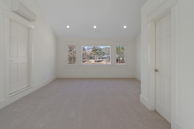 136 Hidden Lake Dr, Eatonton, GA 31024 - empty room with vaulted ceiling, recessed lighting, a wall unit AC, and light colored carpet