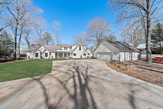 136 Hidden Lake Dr, Eatonton, GA 31024 - view of front of home with a garage, a front lawn, and an outdoor structure