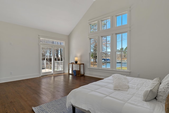 136 Hidden Lake Dr, Eatonton, GA 31024 - bedroom featuring high vaulted ceiling, access to outside, baseboards, and wood finished floors