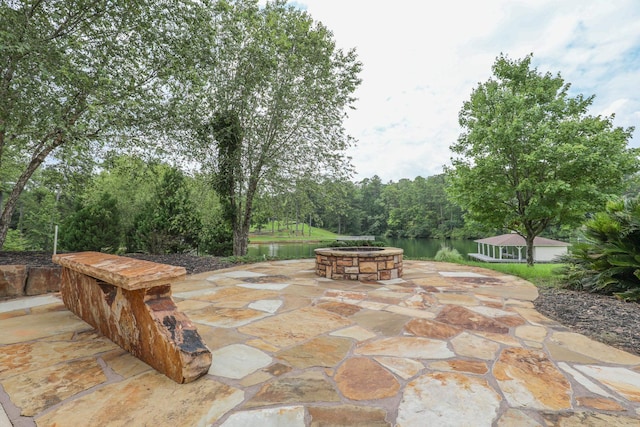 view of patio with a water view