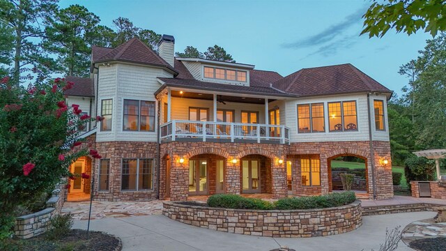 256 Jule Ingram Rd, Milledgeville, GA 31061 - back house at dusk with a balcony and a patio area