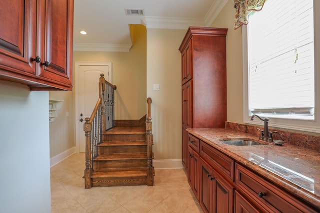 interior space featuring ornamental molding, tile patterned flooring, and sink