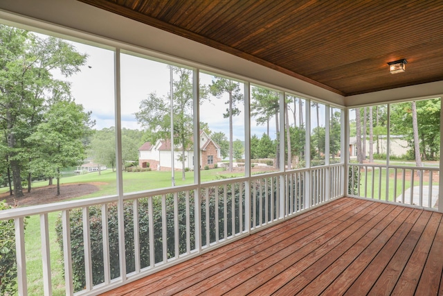 unfurnished sunroom featuring wooden ceiling