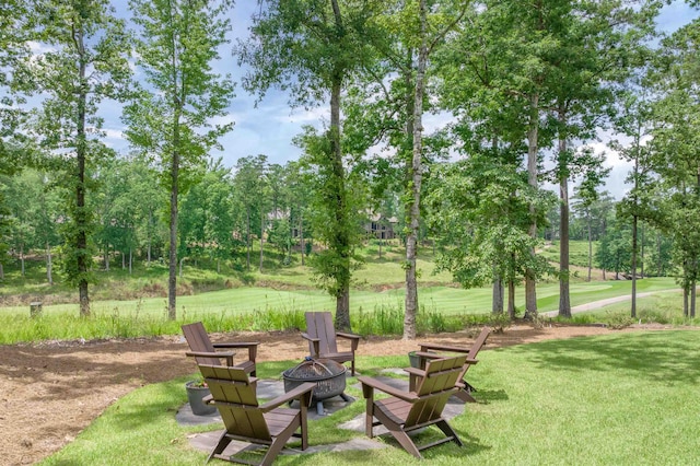 1070 Griffin Crk, Greensboro, GA 30642 - view of grassy yard featuring an outdoor fire pit and view of scattered trees