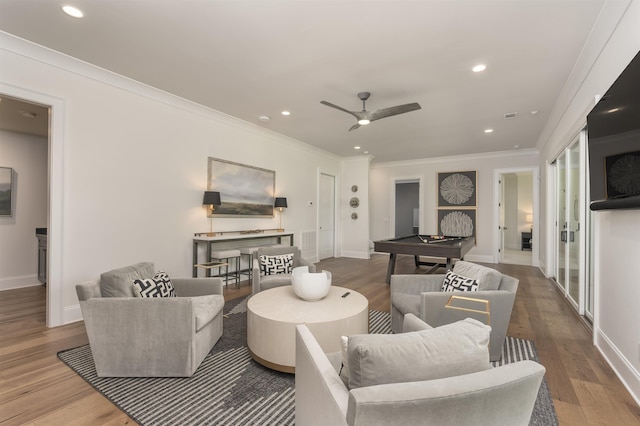 1070 Griffin Crk, Greensboro, GA 30642 - living room with billiards, wood finished floors, recessed lighting, ceiling fan, and crown molding