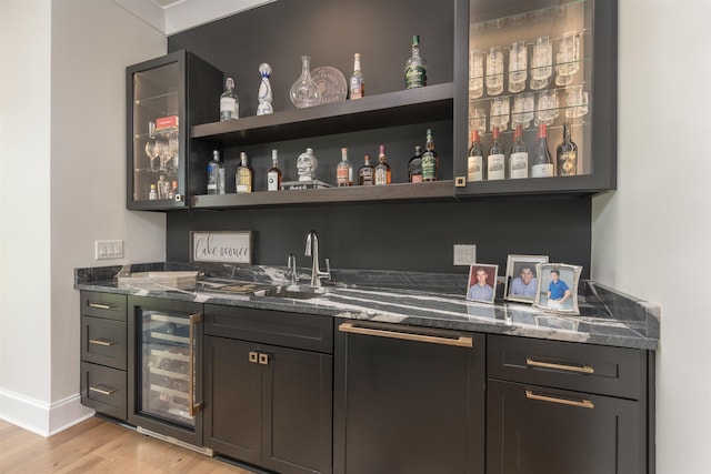 1070 Griffin Crk, Greensboro, GA 30642 - indoor wet bar featuring beverage cooler and light wood-style floors