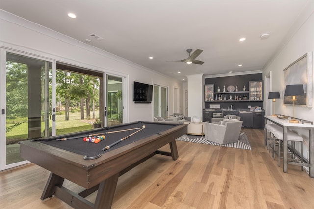 1070 Griffin Crk, Greensboro, GA 30642 - playroom with crown molding, billiards table, light wood-type flooring, a bar, and recessed lighting