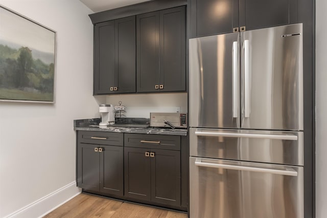 1070 Griffin Crk, Greensboro, GA 30642 - kitchen with freestanding refrigerator and light wood-style floors
