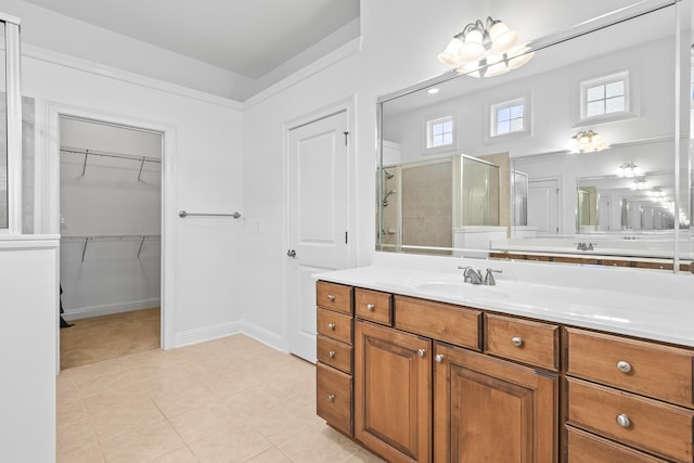 bathroom with vanity, tile patterned floors, and walk in shower