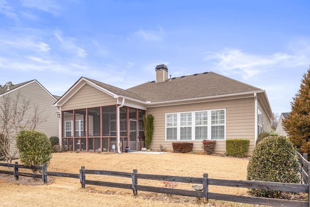 rear view of house with a sunroom