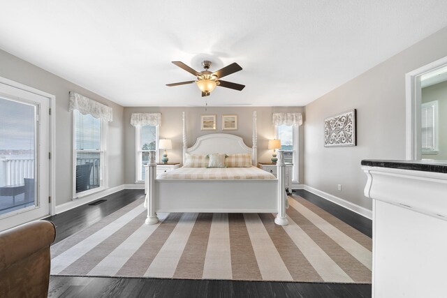 408 Sheffield Ln, Sparta, GA 31087 - bedroom with visible vents, baseboards, and wood finished floors