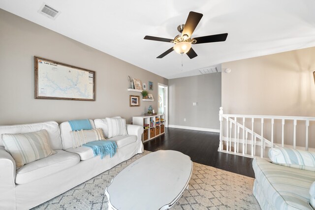 408 Sheffield Ln, Sparta, GA 31087 - living area featuring visible vents, baseboards, a ceiling fan, and wood finished floors