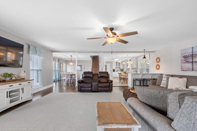 408 Sheffield Ln, Sparta, GA 31087 - living area with ceiling fan with notable chandelier and wood finished floors