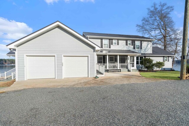 408 Sheffield Ln, Sparta, GA 31087 - view of front of house with an attached garage, driveway, and a porch