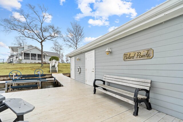 408 Sheffield Ln, Sparta, GA 31087 - wooden deck featuring stairs, a sunroom, and a lawn