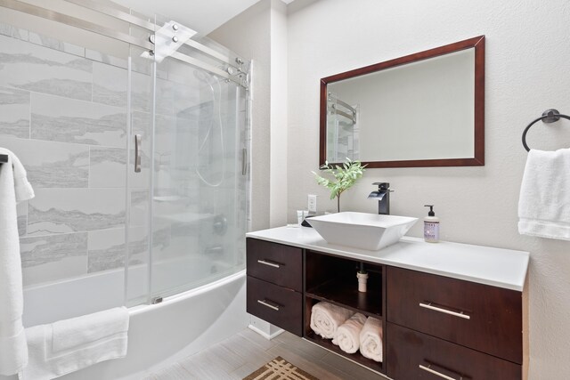408 Sheffield Ln, Sparta, GA 31087 - bathroom featuring shower / bath combination with glass door and vanity