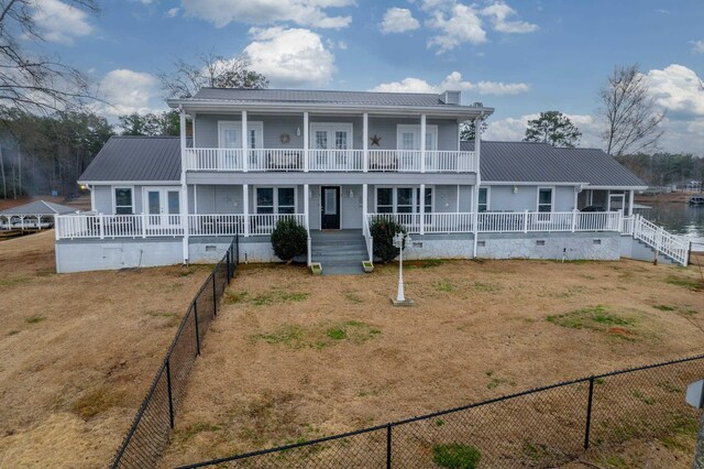 408 Sheffield Ln, Sparta, GA 31087 - view of front of house with crawl space, a porch, metal roof, a balcony, and a chimney