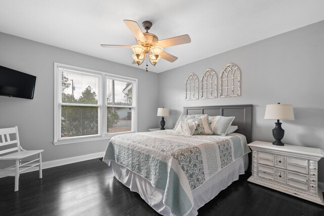 408 Sheffield Ln, Sparta, GA 31087 - bedroom with dark wood-type flooring, baseboards, and a ceiling fan