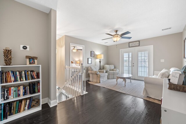 408 Sheffield Ln, Sparta, GA 31087 - living room with ceiling fan, dark wood finished floors, visible vents, french doors, and baseboards