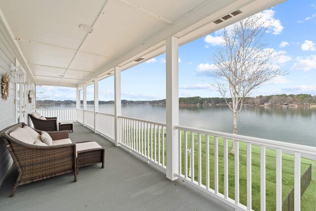 408 Sheffield Ln, Sparta, GA 31087 - sunroom / solarium featuring plenty of natural light and a water view