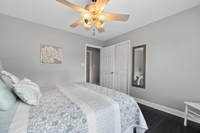 408 Sheffield Ln, Sparta, GA 31087 - bedroom with dark wood-type flooring, a closet, baseboards, and ceiling fan