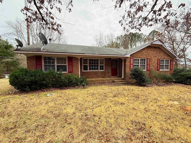 ranch-style home with a front yard