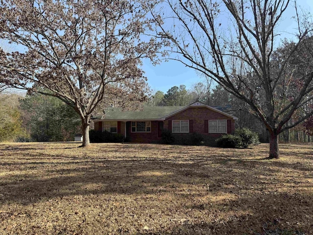 ranch-style house with a front yard