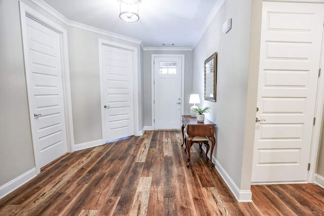 entrance foyer featuring dark wood-type flooring and ornamental molding