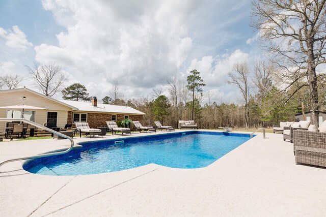 251 Pettigrew Rd, Milledgeville, GA 31061 - outdoor pool featuring an outdoor living space and a patio area