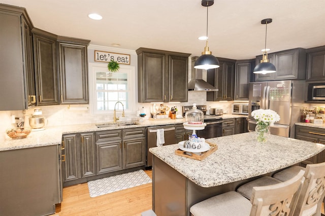 251 Pettigrew Rd, Milledgeville, GA 31061 - kitchen with a sink, a kitchen breakfast bar, a center island, stainless steel appliances, and decorative backsplash