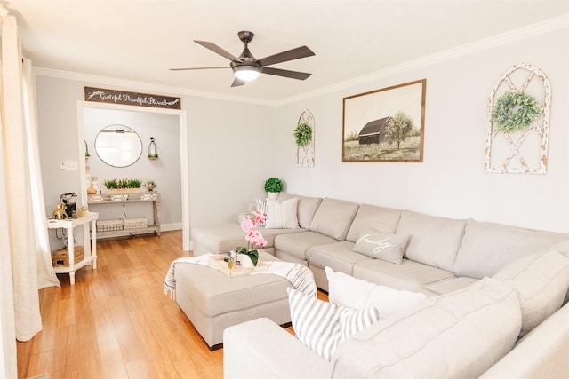 251 Pettigrew Rd, Milledgeville, GA 31061 - living room featuring a ceiling fan, light wood-style flooring, and crown molding
