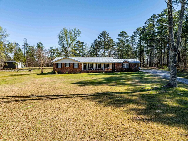 251 Pettigrew Rd, Milledgeville, GA 31061 - single story home featuring brick siding and a front lawn