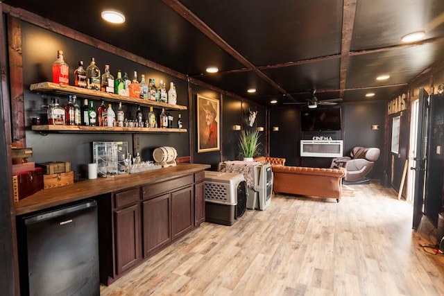 251 Pettigrew Rd, Milledgeville, GA 31061 - bar featuring a bar, fridge, light wood finished floors, and ceiling fan