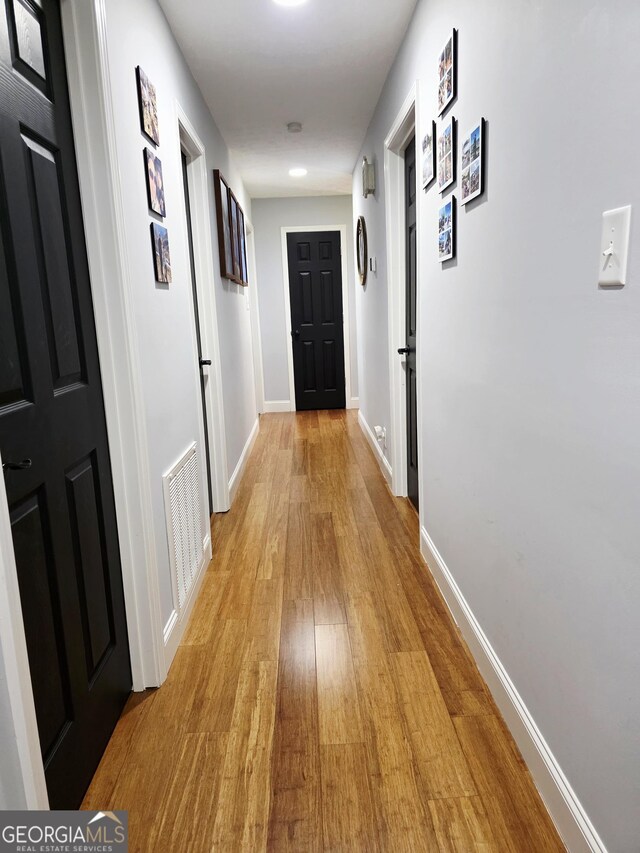 251 Pettigrew Rd, Milledgeville, GA 31061 - corridor featuring baseboards, visible vents, and light wood finished floors